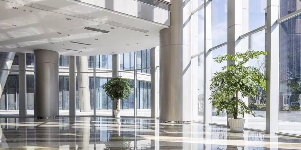 mechanical services-The lobby of a modern office building with large windows, offering top-notch HVAC services in Northern Virginia.