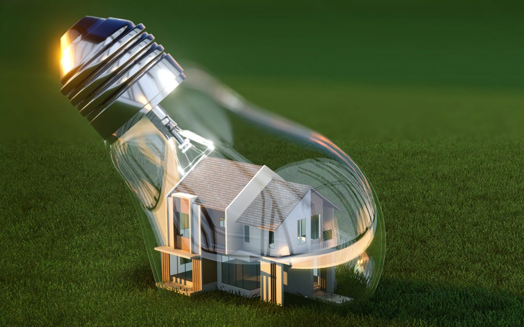A light bulb with a house inside of it.